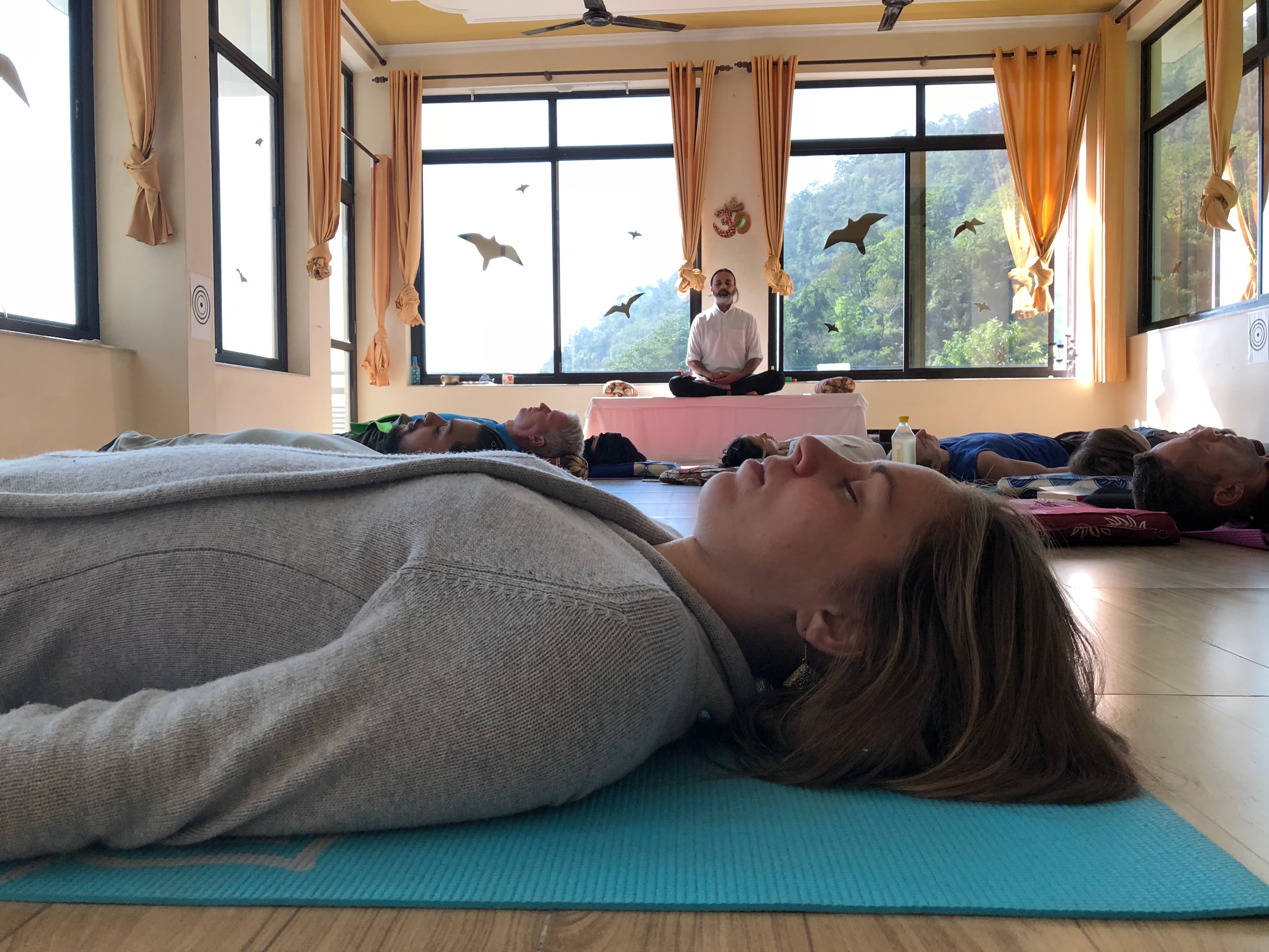 Students meditating in a yoga class