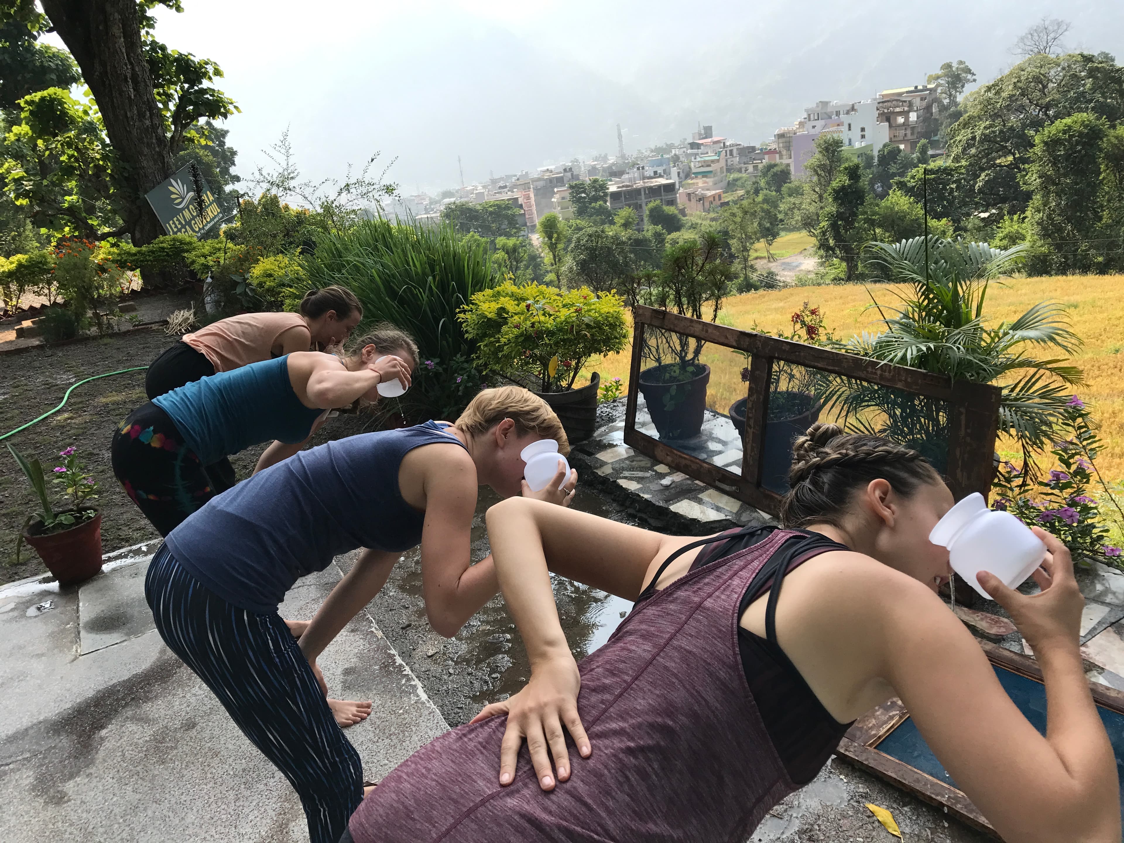Teacher guiding yoga students